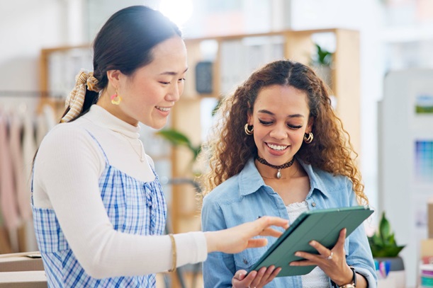 Woman, fashion designer and tablet in meeting