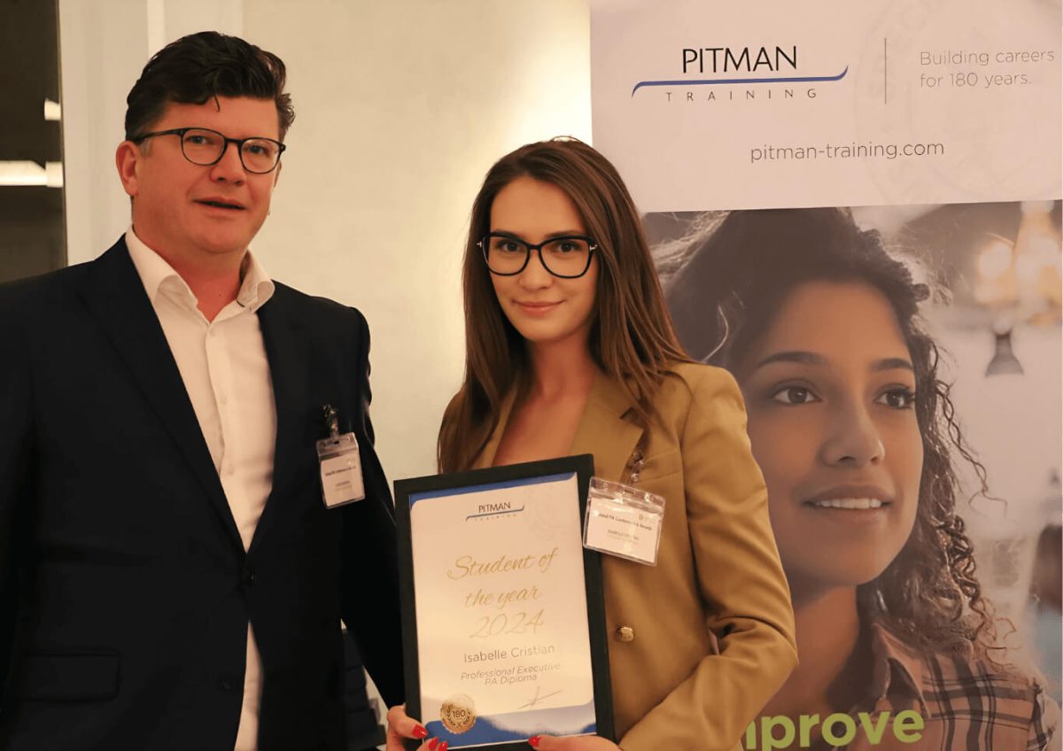 Isabelle Christian receives Student of the Year award from Chris Hodson at Pitman Training London
